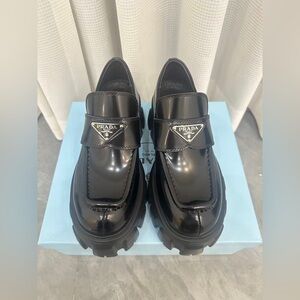 Prada Women’s Glossy Black Slip-On Loafers
